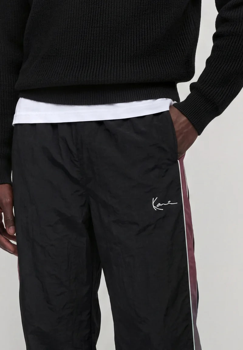Karl Kani Signature Sidestripe Baggy Trackpants black/berry dettaglio
